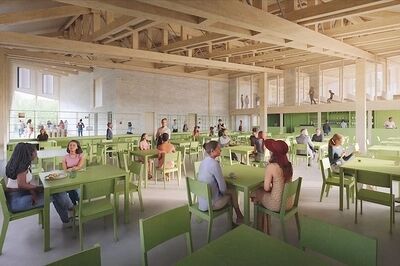 Moderne eetruimte met groene tafels en stoelen, waarin mensen aan verschillende tafels zitten en met elkaar praten.